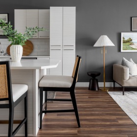 a living room with a couch and a dining table