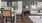 a living room with a couch and a dining table
