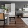 a living room with a couch and a dining table