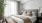 a bedroom with a large window